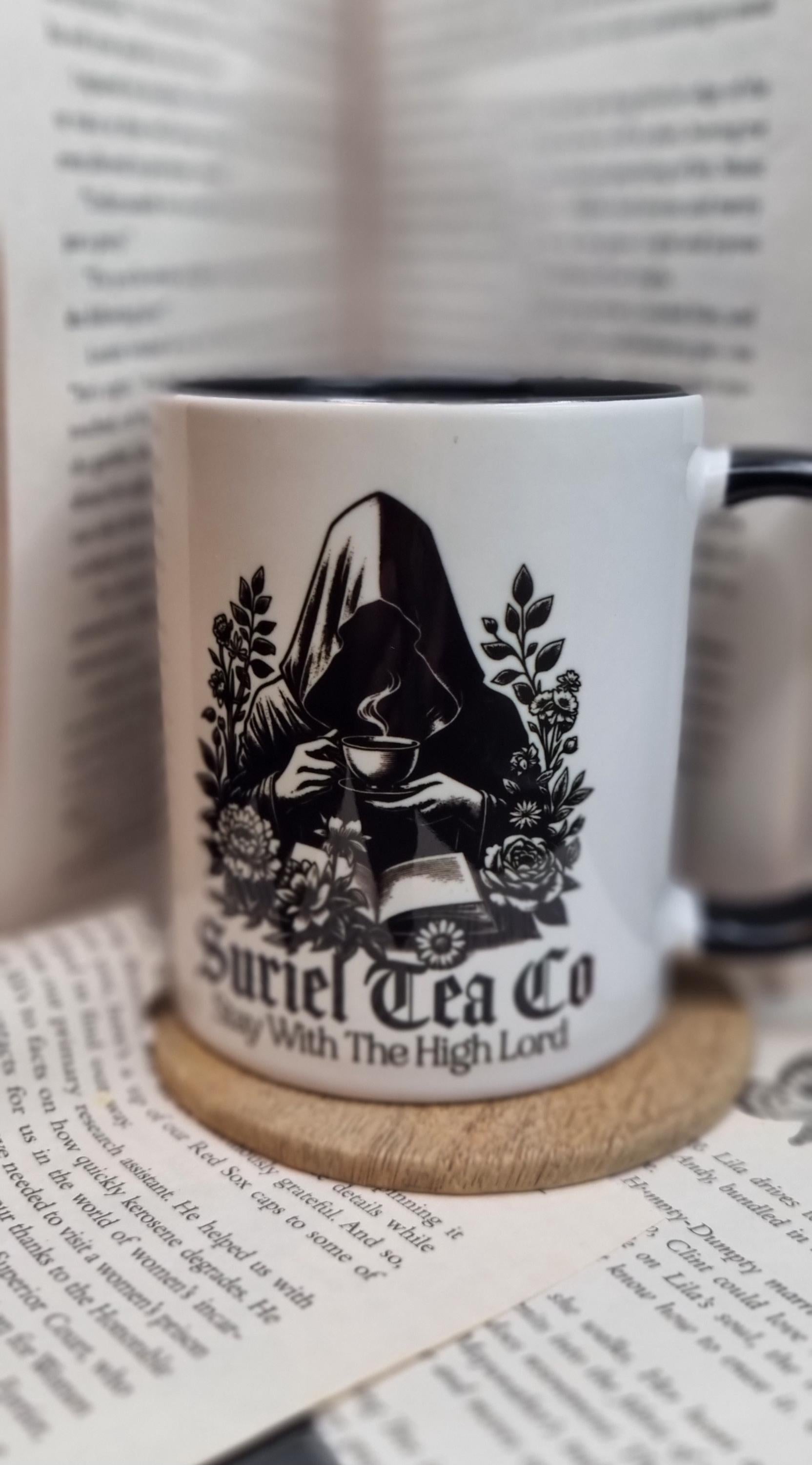 Acotar themed mug gift featuring a dark cloaked figure drinking tea with floral design