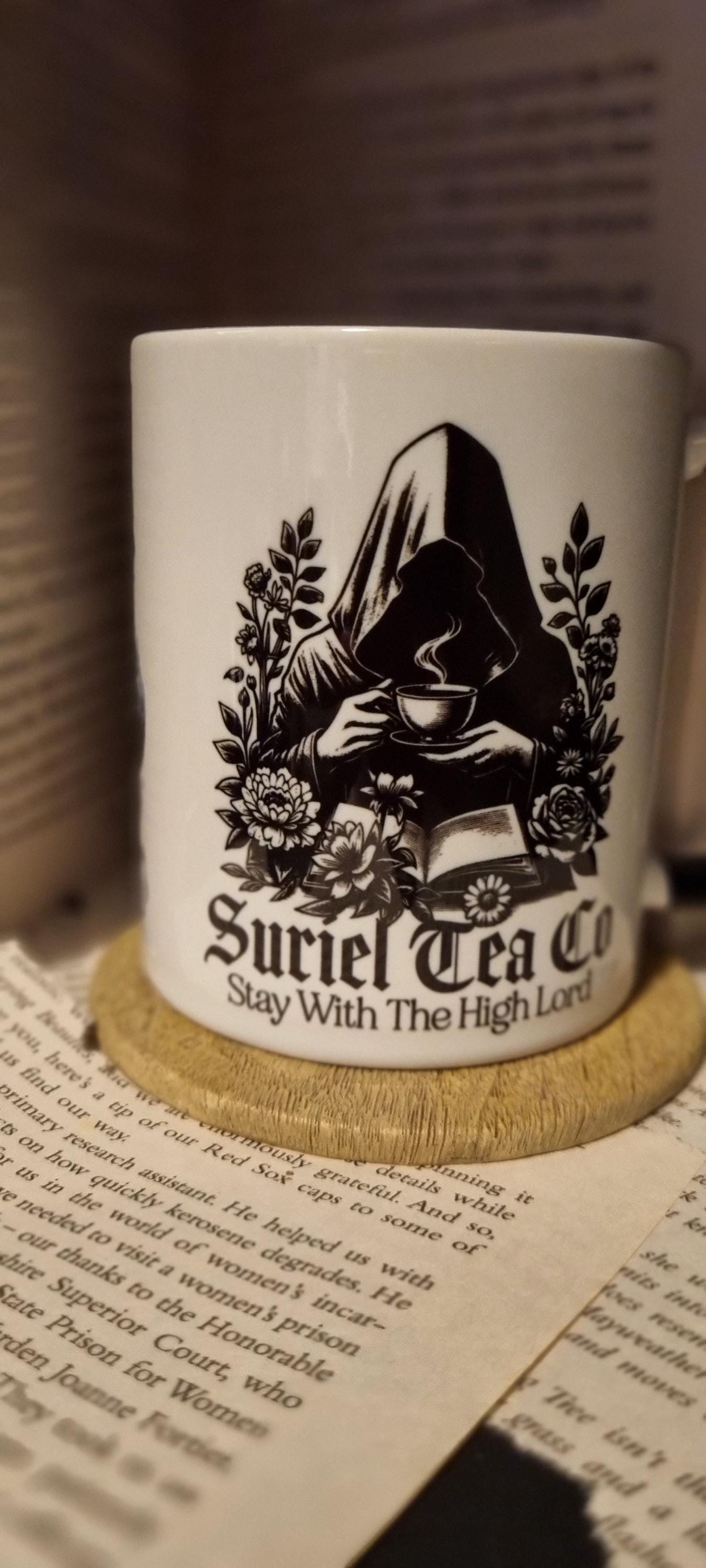 Acotar themed mug gift featuring Suriel Tea Co design with hooded figure holding a cup