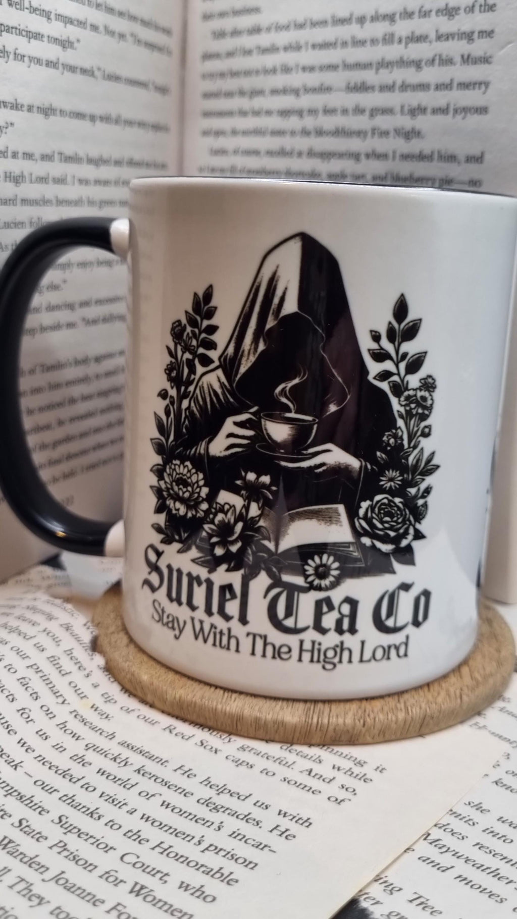 Acotar themed mug gift with Suriel Tea Co design featuring a cloaked figure holding a teacup and floral details