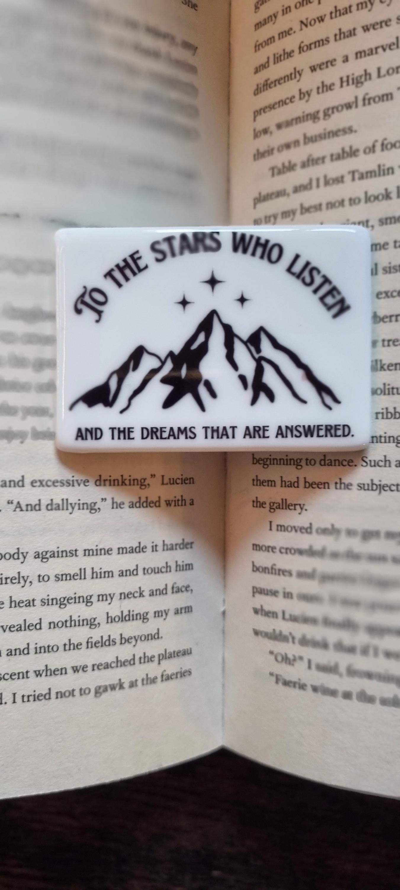 City of Starlight bookish magnet with mountain design and inspirational quote on open book background