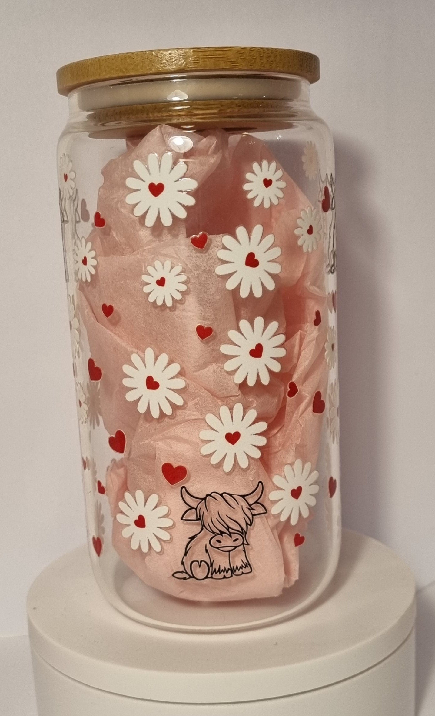 Clear cow and daisy glass tumbler with white daisies red hearts and a small cow design with wooden lid