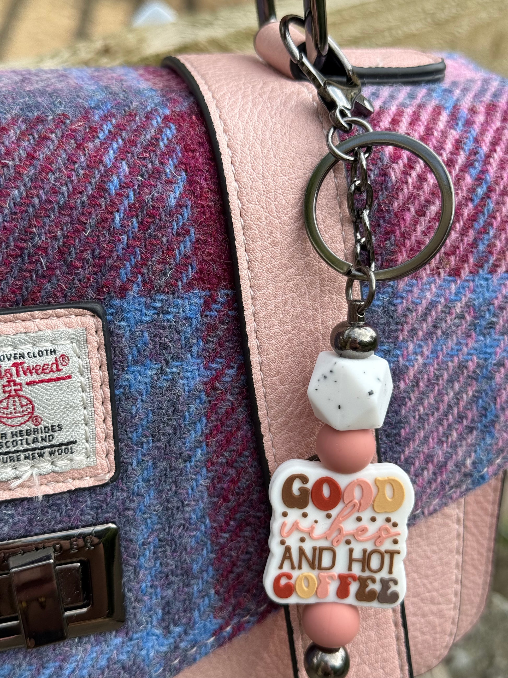 Cute coffee lover keyring with colourful beads and coffee-themed charm on pink and blue tweed handbag