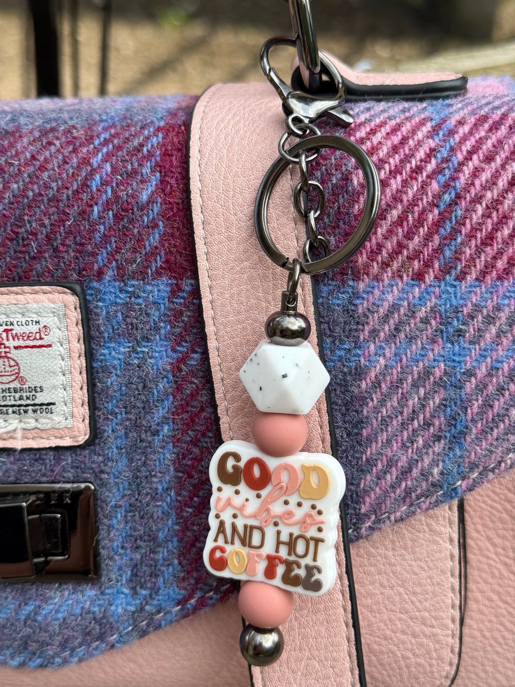 Cute coffee lover keyring with pastel beads and good and hot coffee charm attached to pink and blue tweed handbag