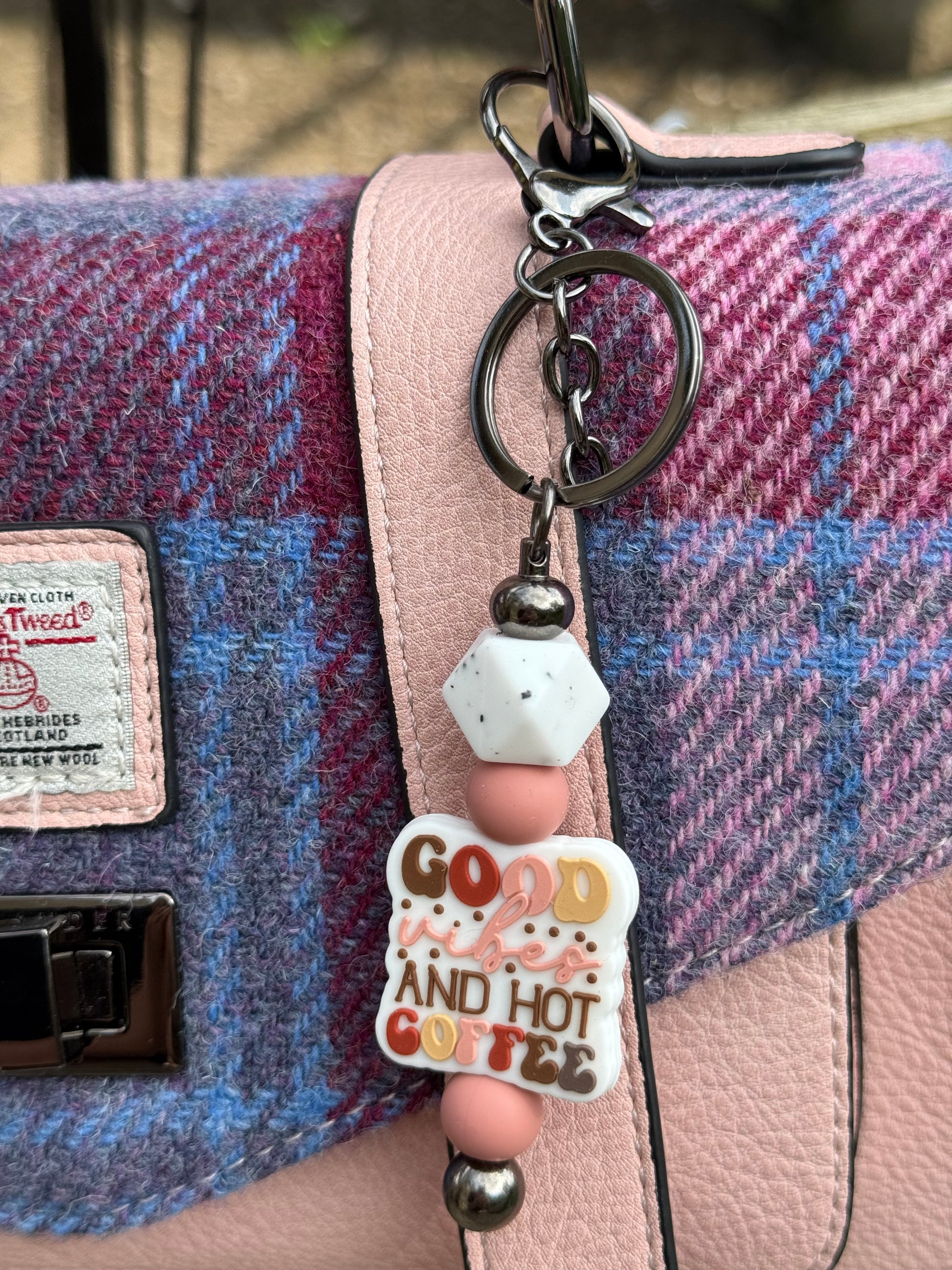 Cute coffee lover keyring with pastel beads and good and hot coffee charm attached to pink and blue tweed handbag