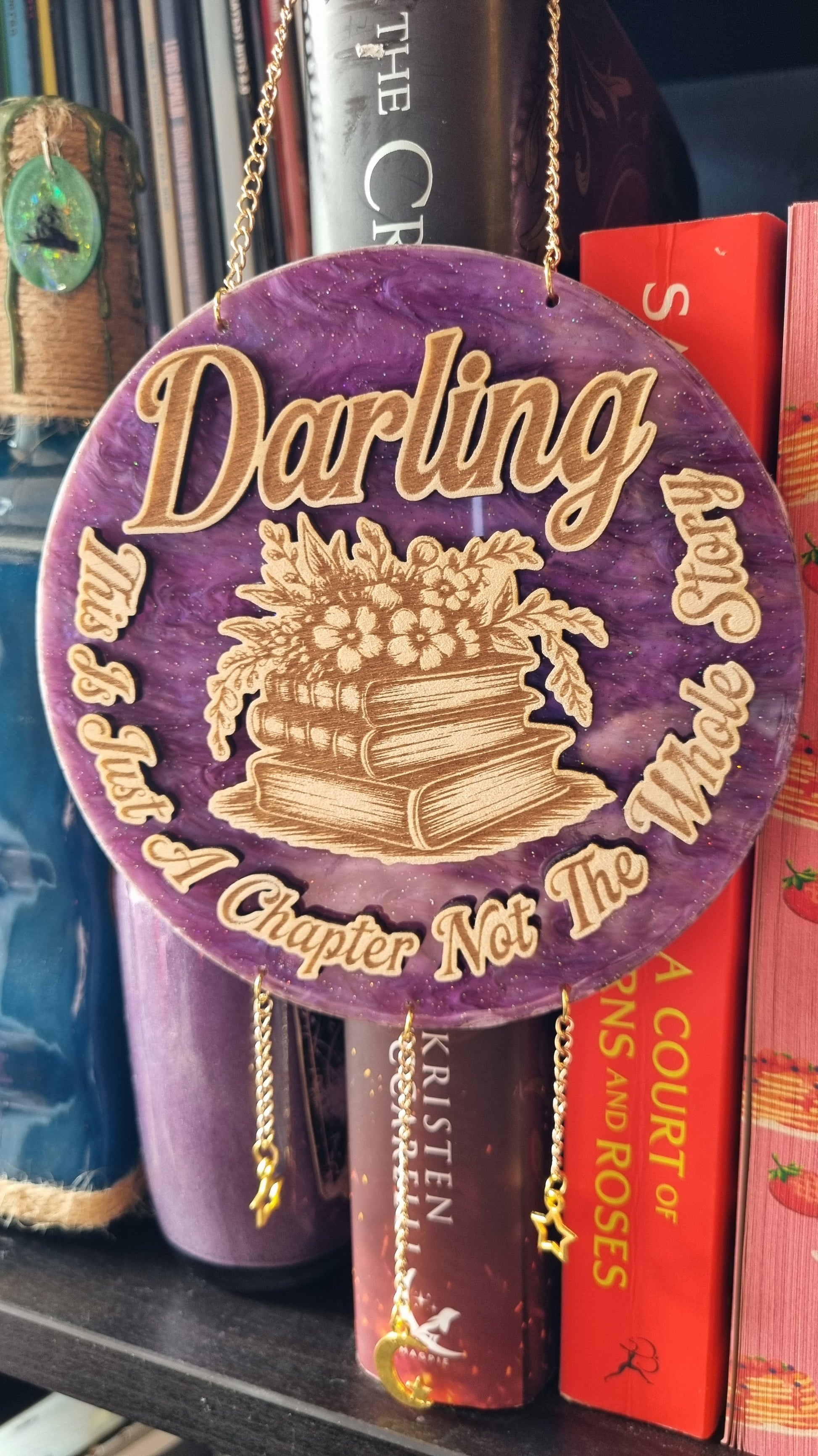 Sublimely Special purple round just a chapter bookish ornament with stack of books and floral design