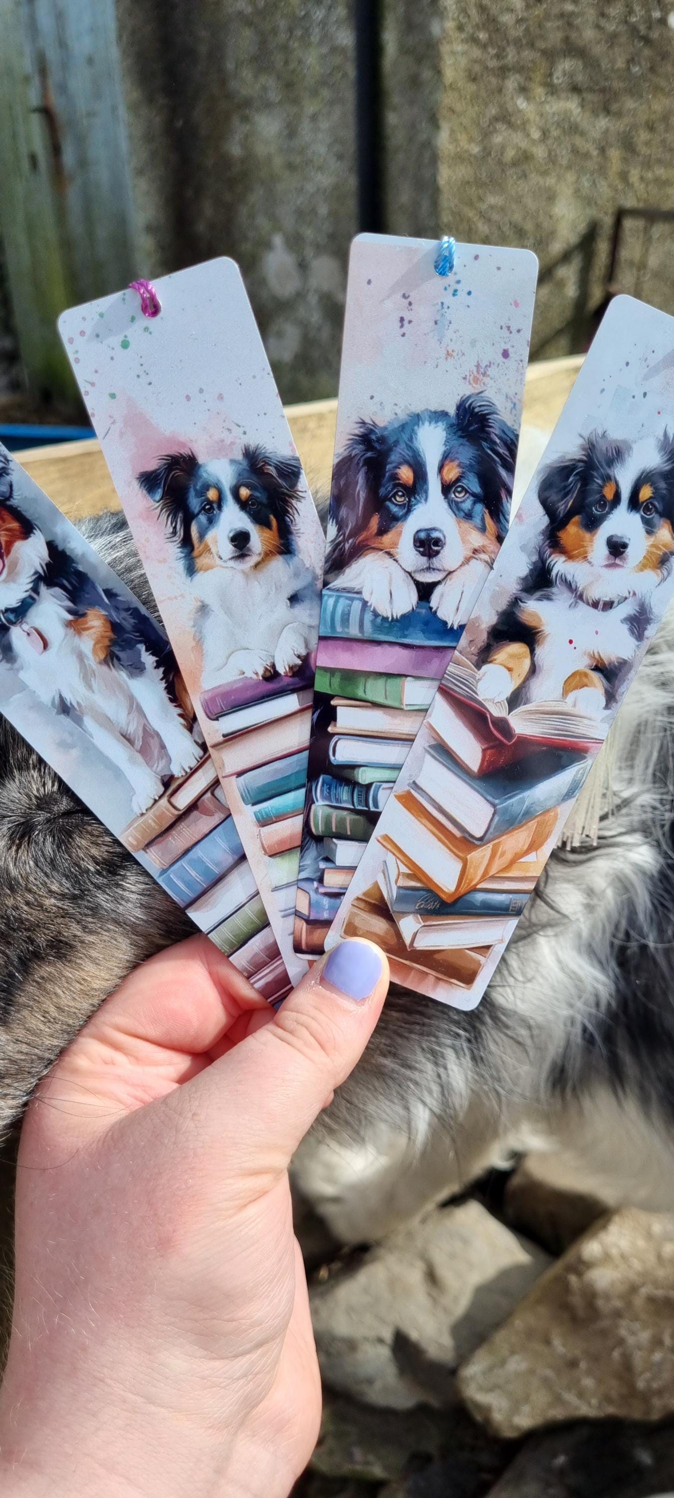Set of bookmarks featuring illustrated dogs stacked on books ideal dog lover gifts for readers