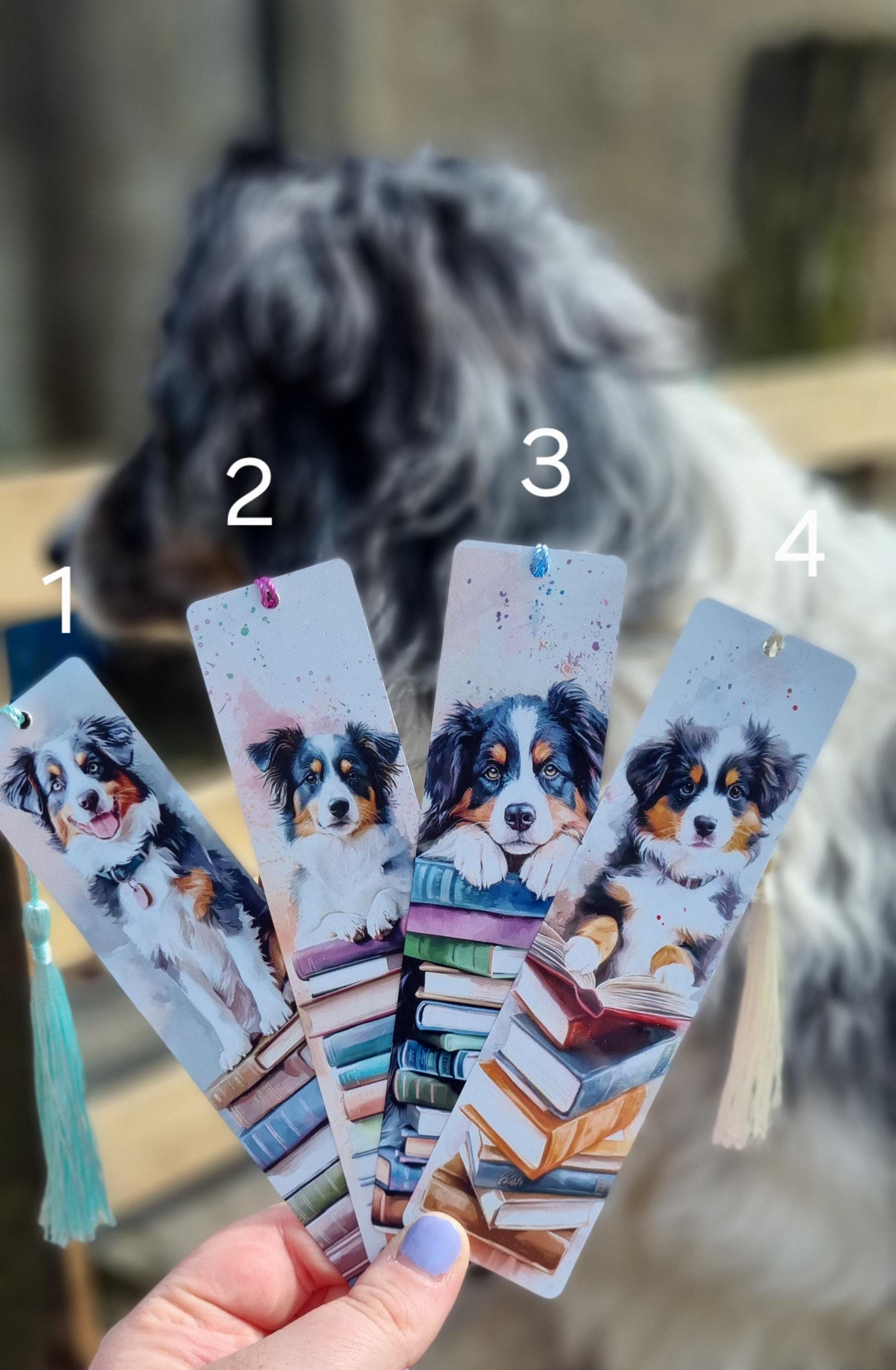 Set of four bookmarks with dog illustrations and stacked books, perfect dog lover gifts for readers