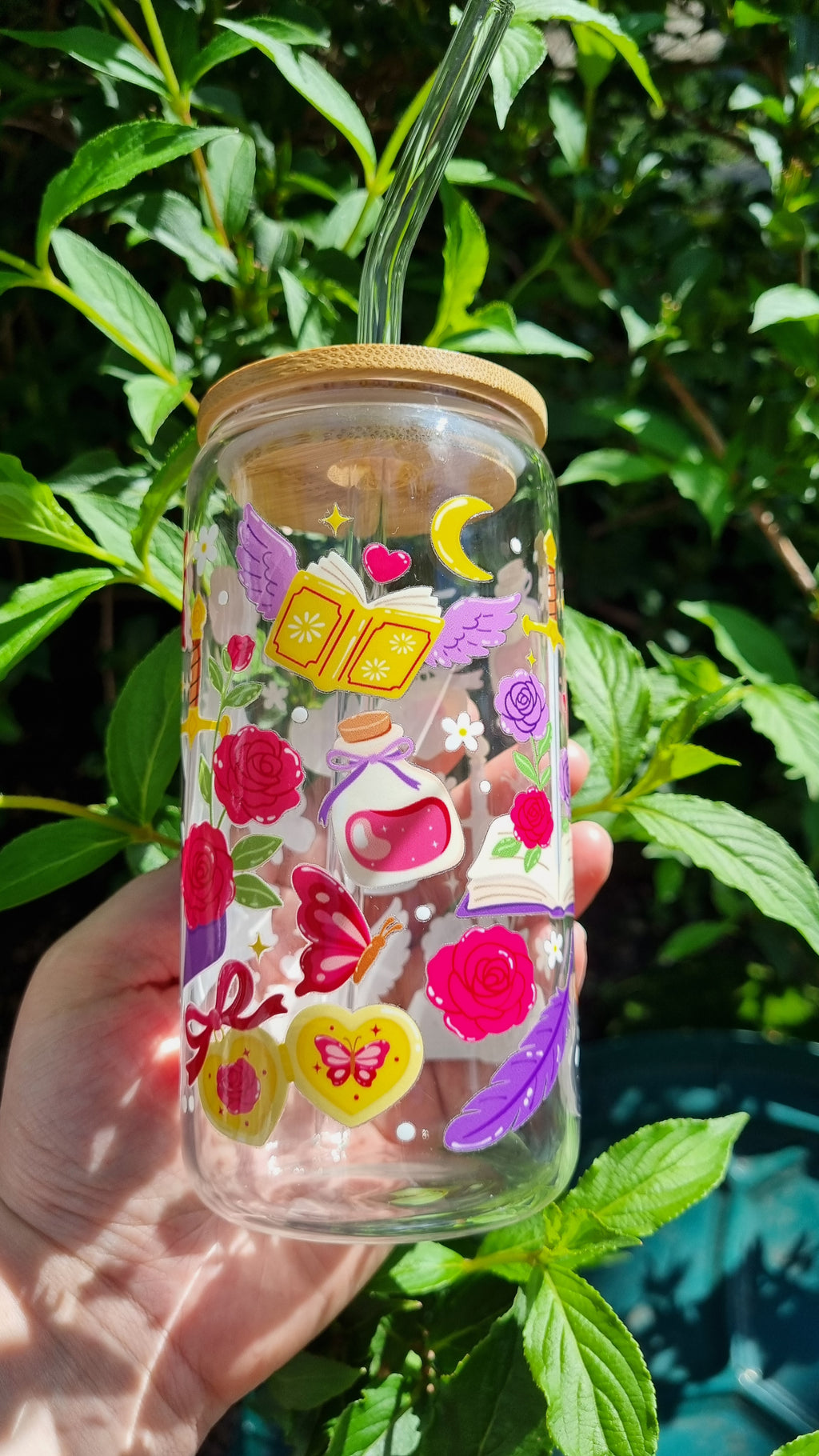 Sublimely Special dragon bookish glass tumbler with colourful fantasy design and bamboo lid held outdoors