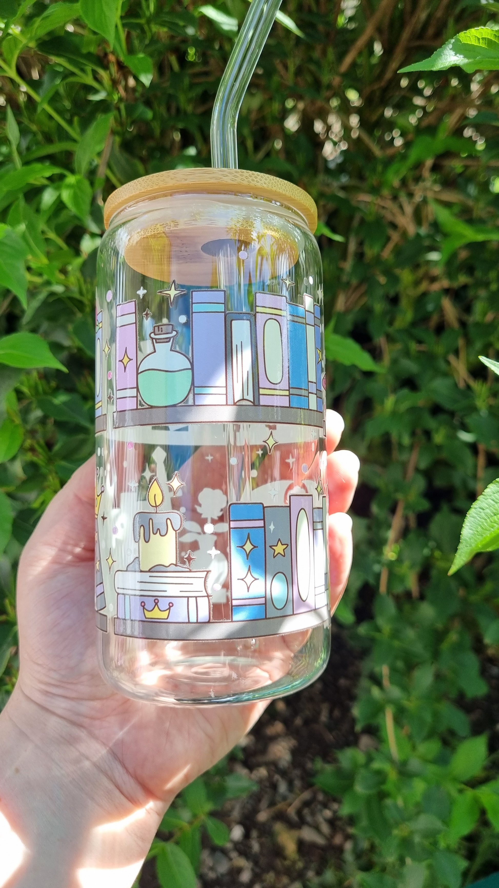 Sublimely Special fantasy bookshelf glass tumbler with colourful book and candle illustrations, bamboo lid and glass straw