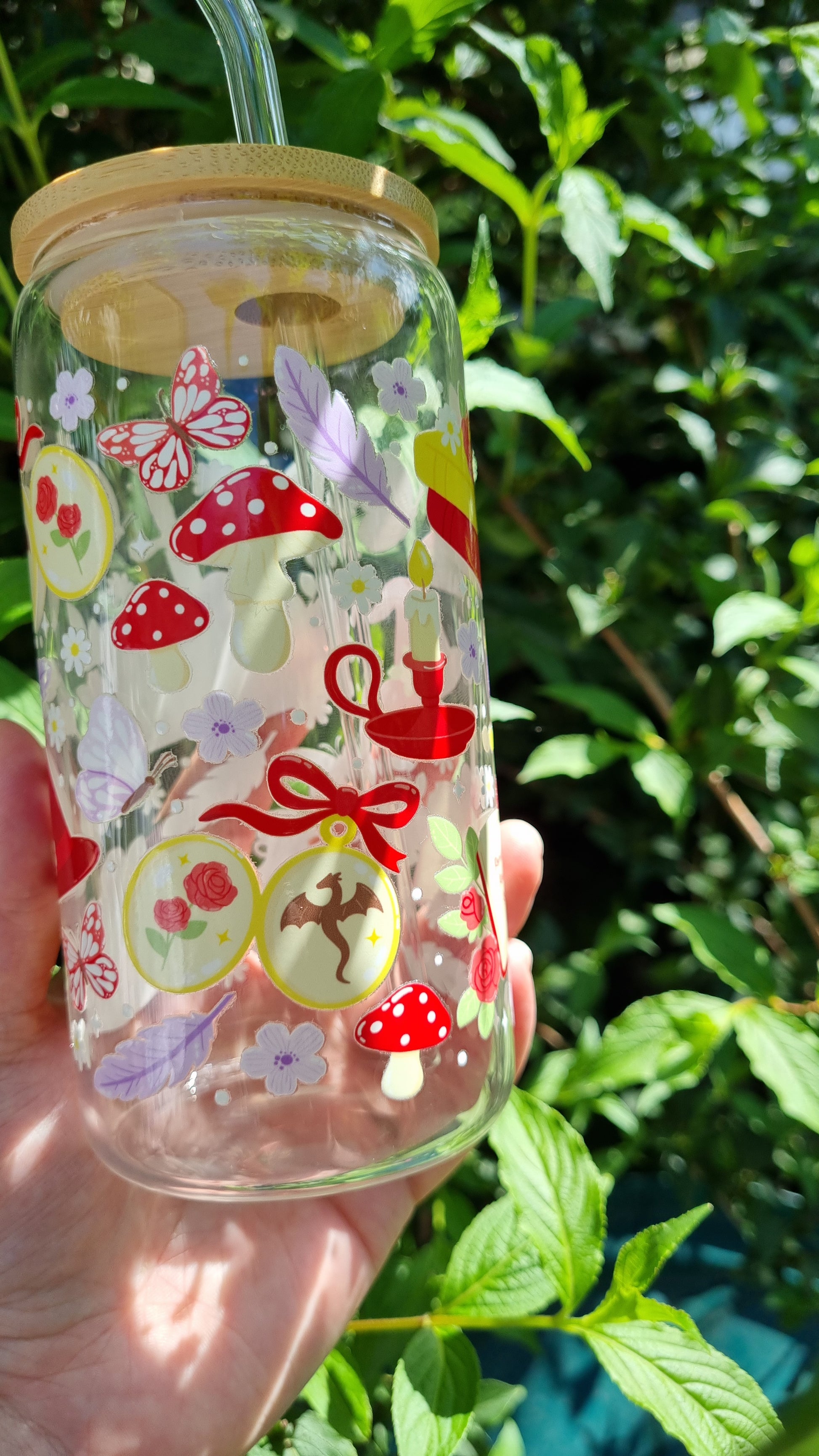 Fantasy romance bookish tumbler with red mushrooms, butterflies, candles and floral designs by Sublimely Special
