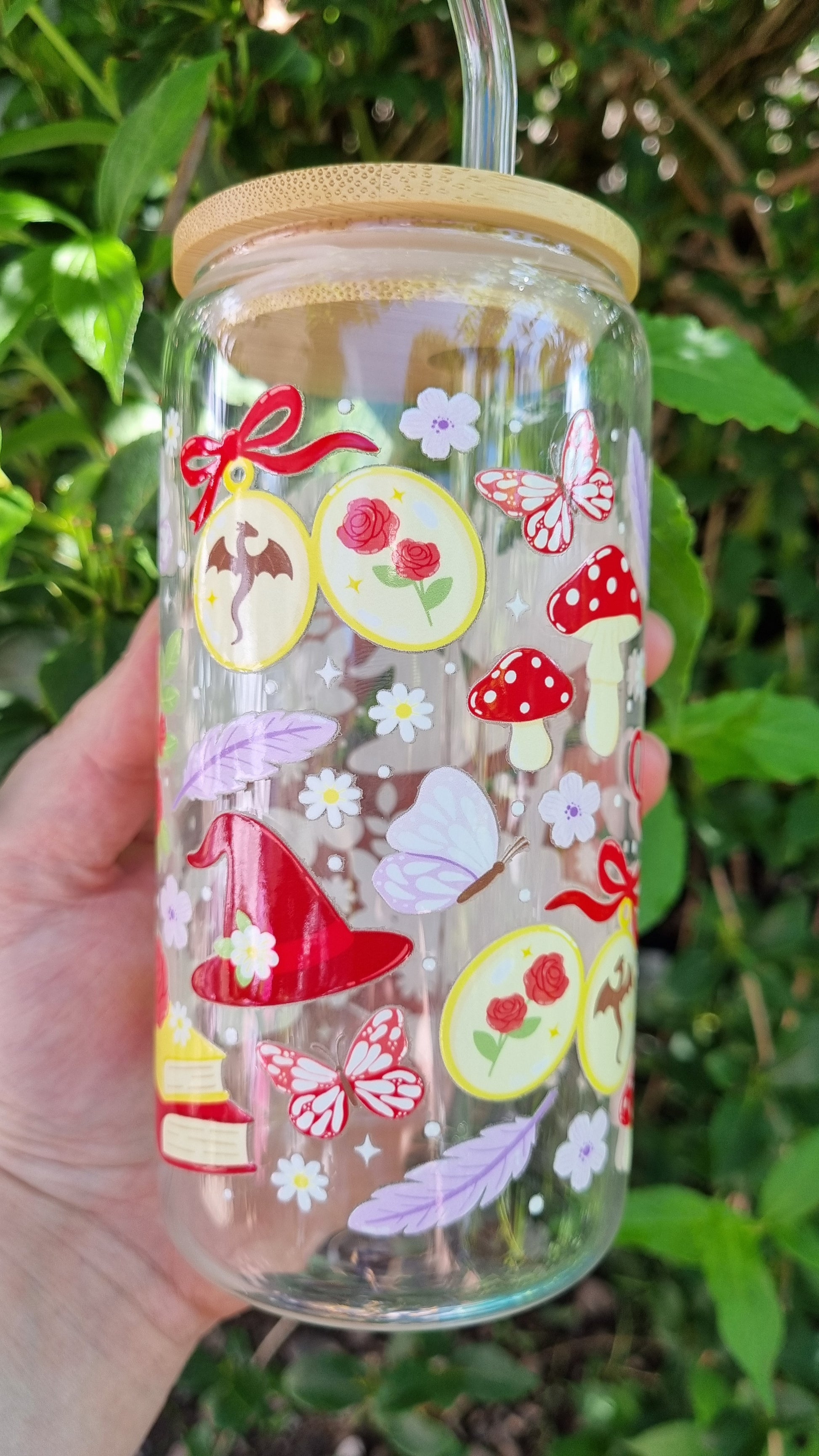 Fantasy romance bookish tumbler with whimsical mushroom, butterfly, rose, and magic hat designs