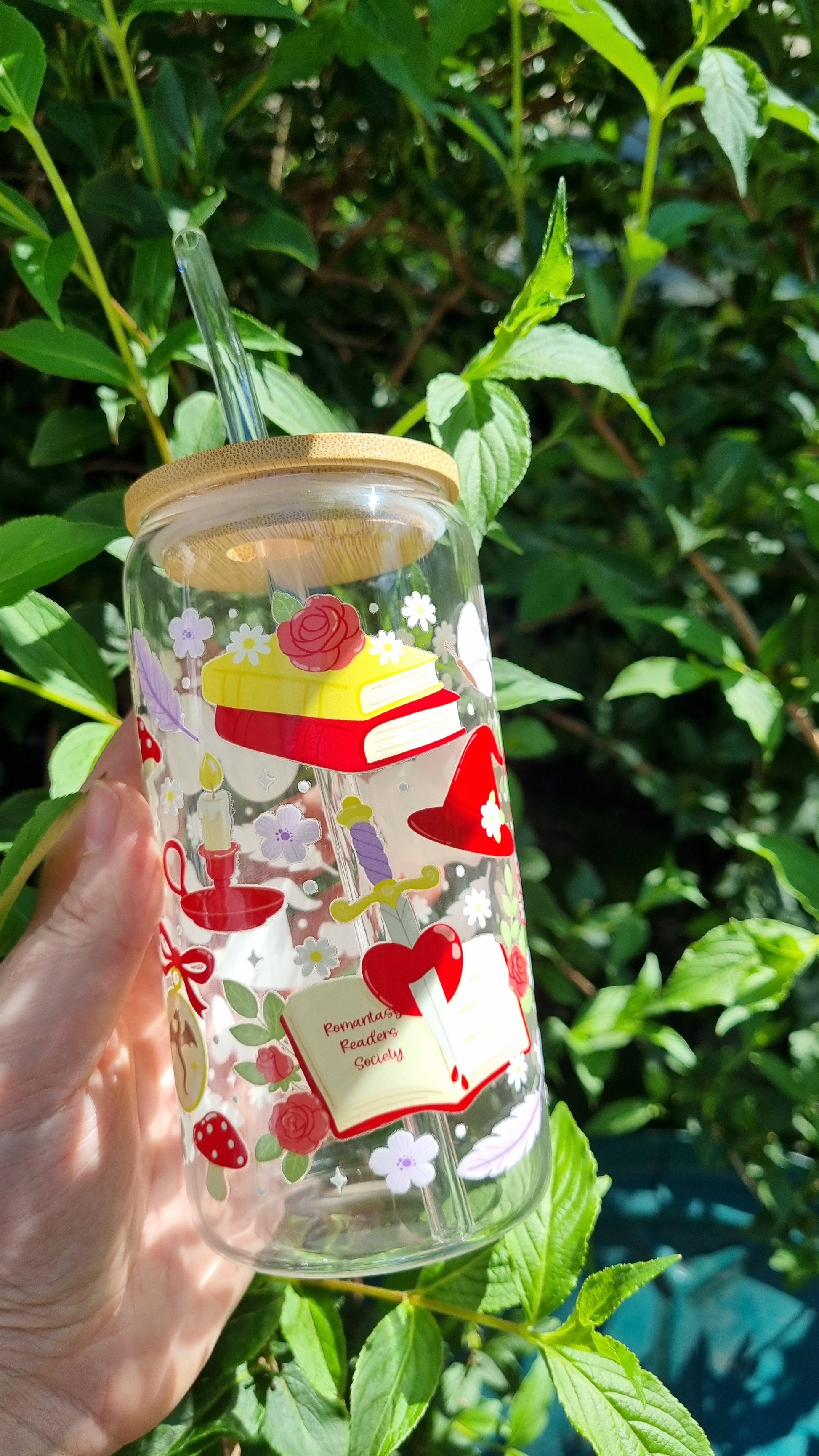 Sublimely Special fantasy romance bookish tumbler with colourful whimsical book and tea designs held outdoors