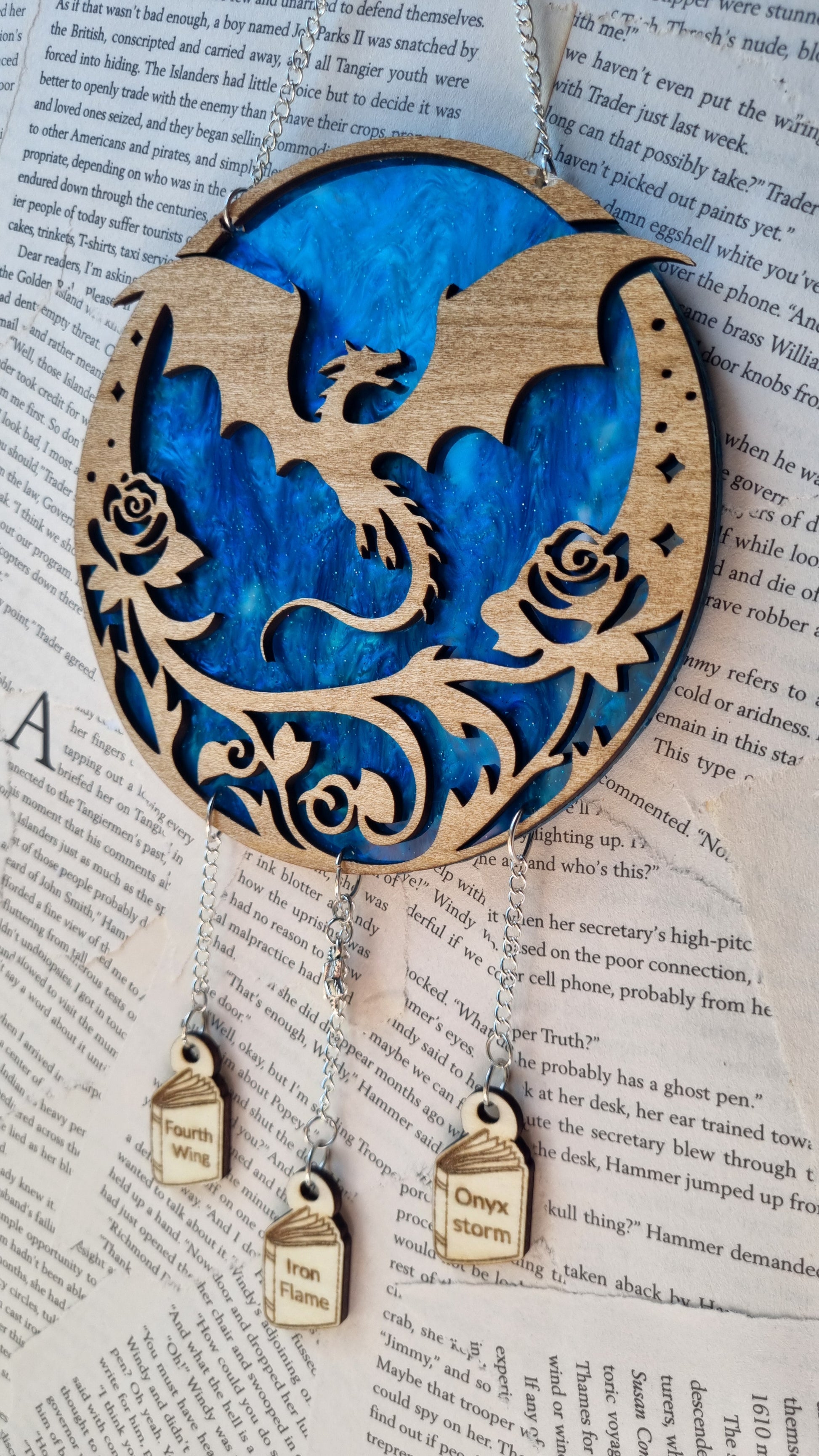 Fourth Wing inspired ornament featuring a dragon silhouette with floral design and hanging wooden charms