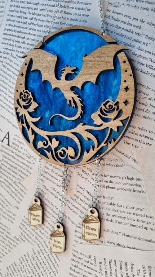 Fourth Wing inspired ornament featuring a dragon silhouette with floral design and hanging wooden charms