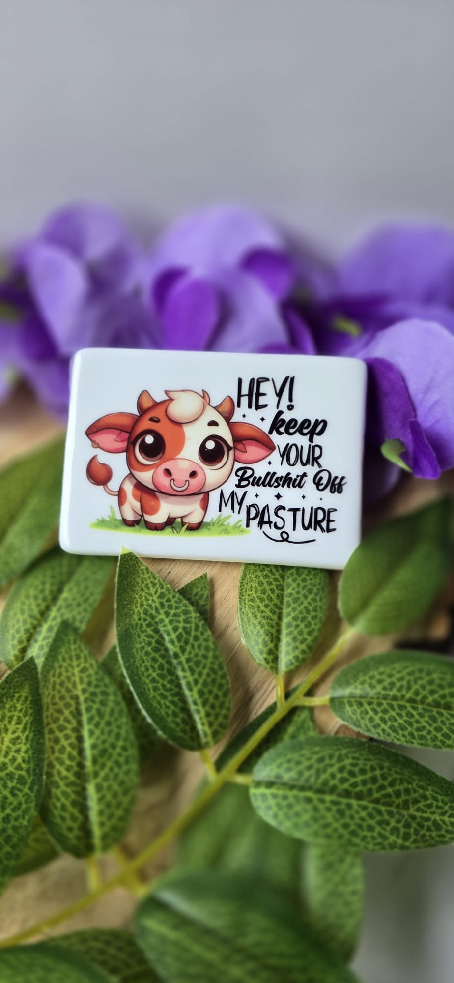 Funny cow fridge magnet featuring a cute cartoon cow with humorous text on a white background