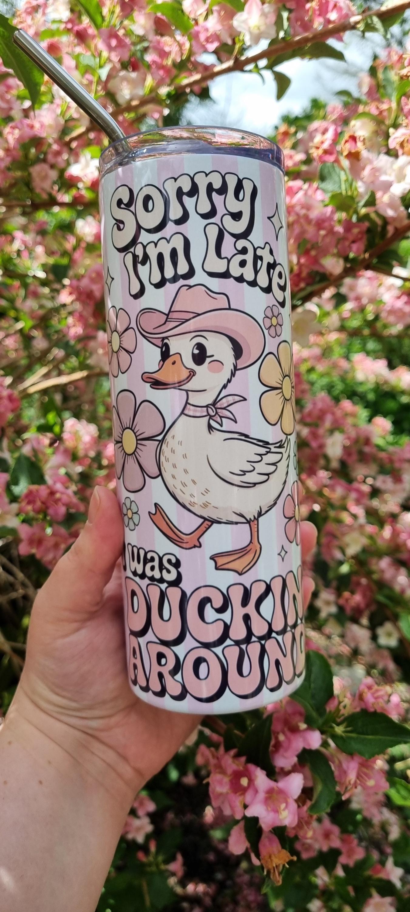 Funny duck tumbler featuring a cute duck with a cowboy hat and text Sorry I'm Late was Duckin Around