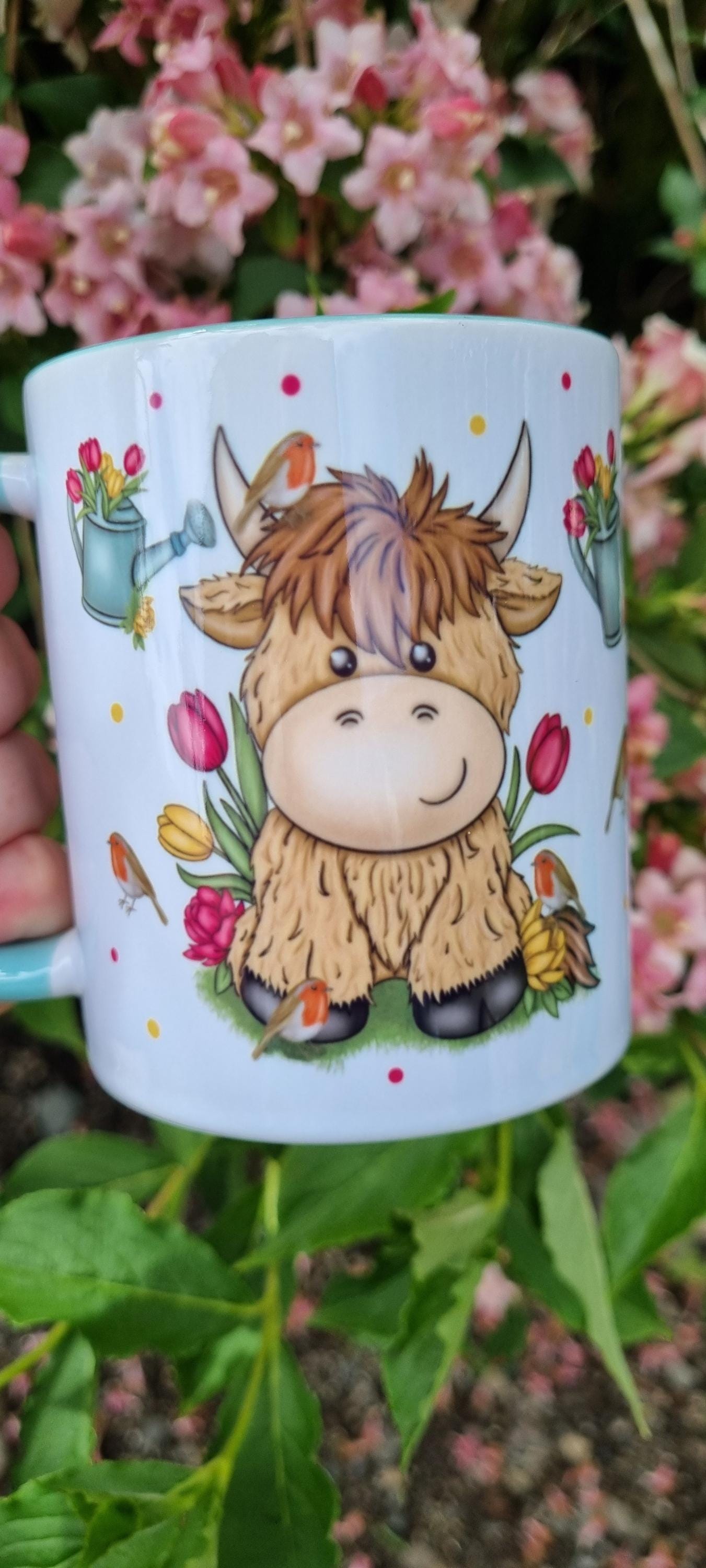 Cute highland cow gift for animal lovers mug with floral and watering can design