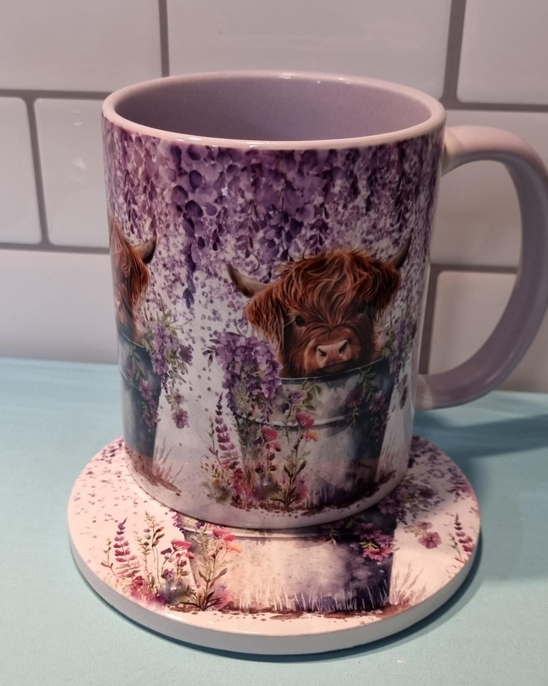 Lilac highland cow mug with purple floral design featuring a brown highland cow and matching coaster
