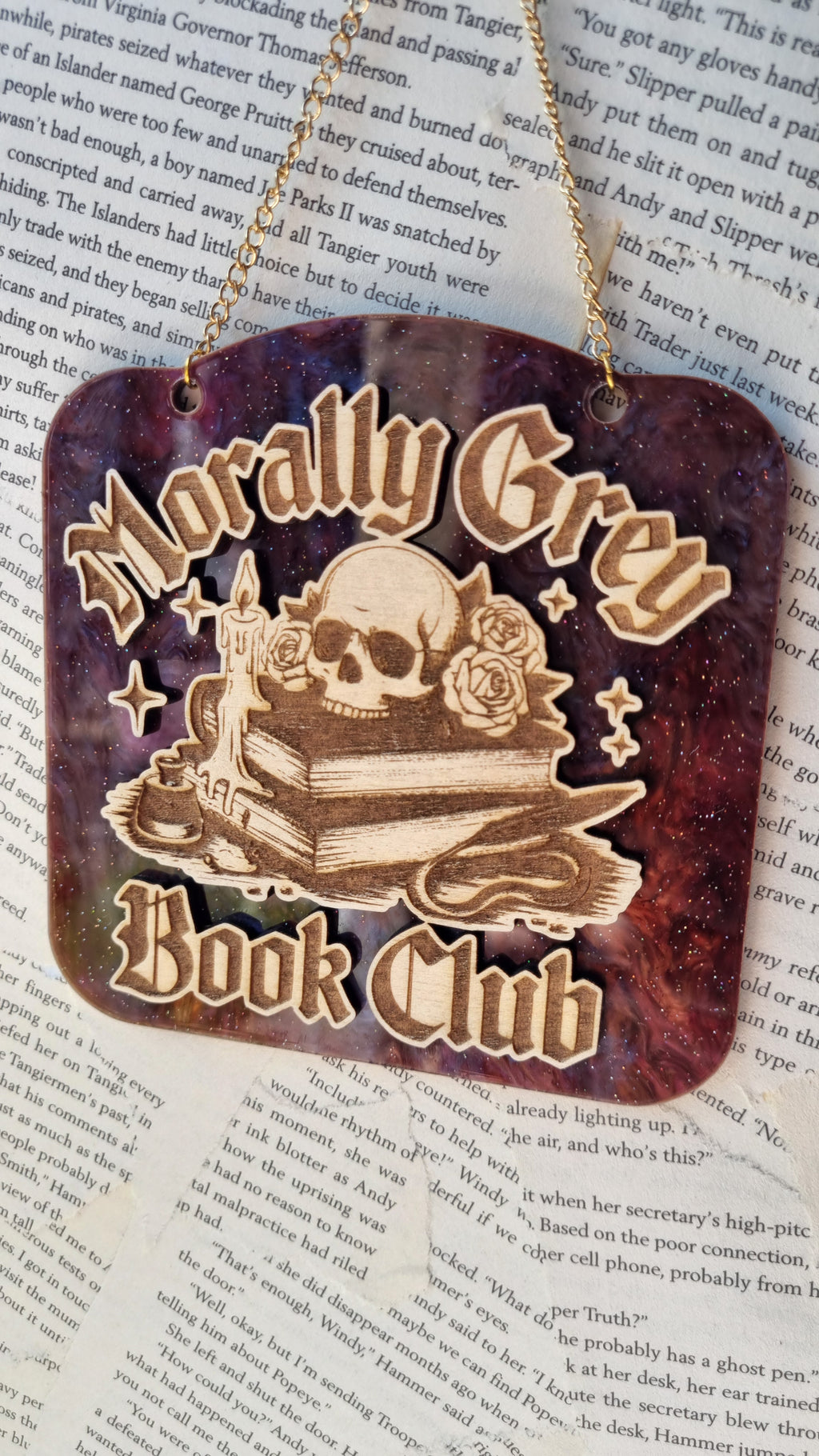 Morally grey book club ornament by Sublimely Special featuring skull and books design on cosmic background