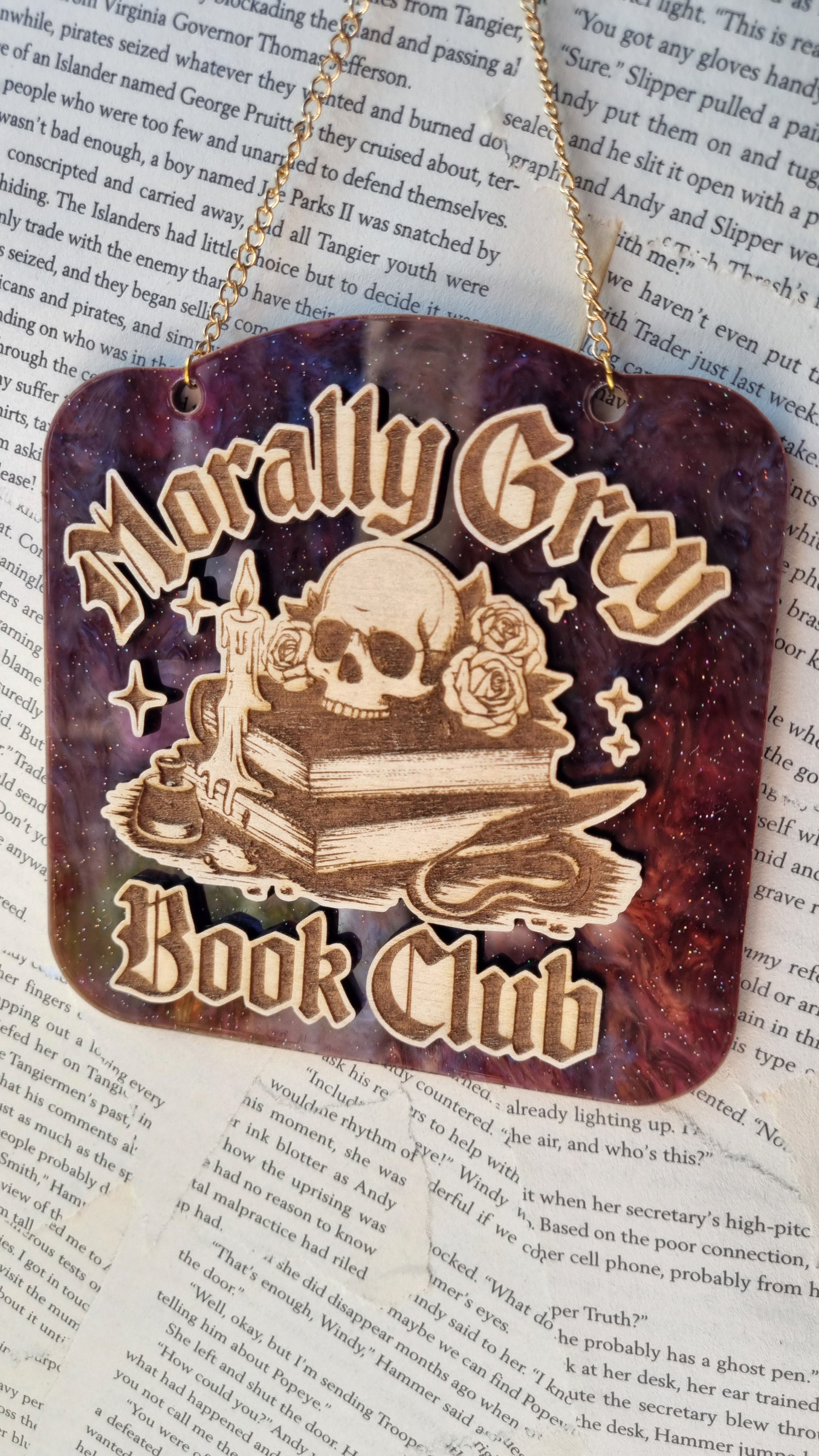 Morally grey book club ornament by Sublimely Special featuring skull and books design on cosmic background