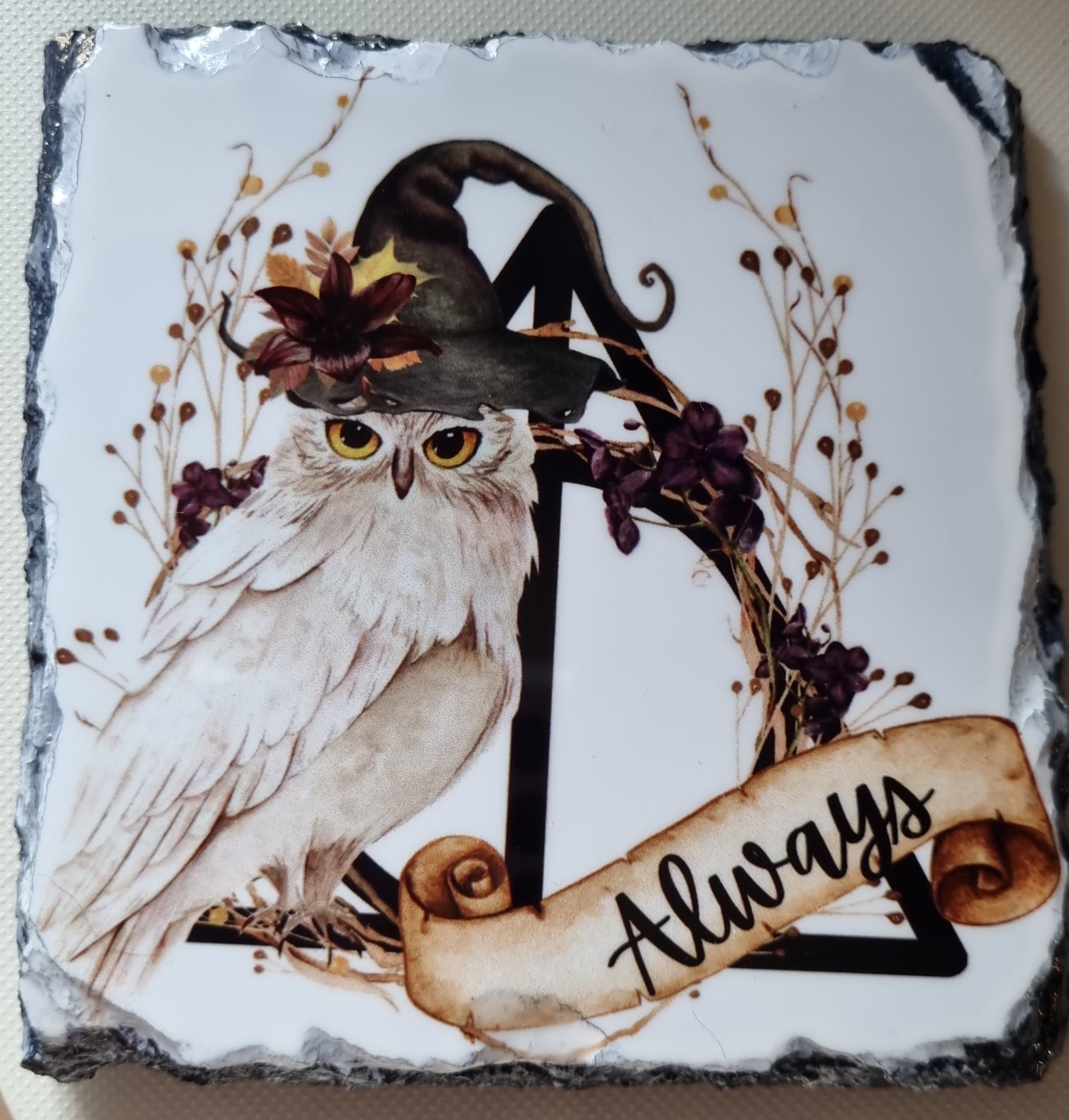 Owl slate coaster featuring a white owl with a witch hat and floral decoration with Always scroll design