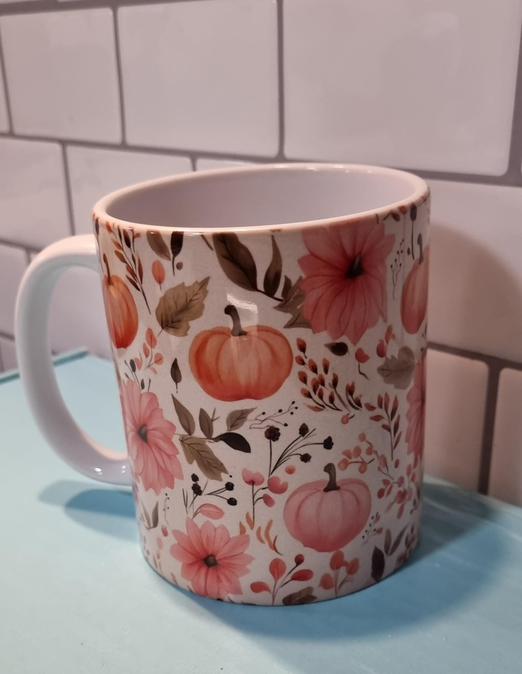 White ceramic pumpkin and flowers mug