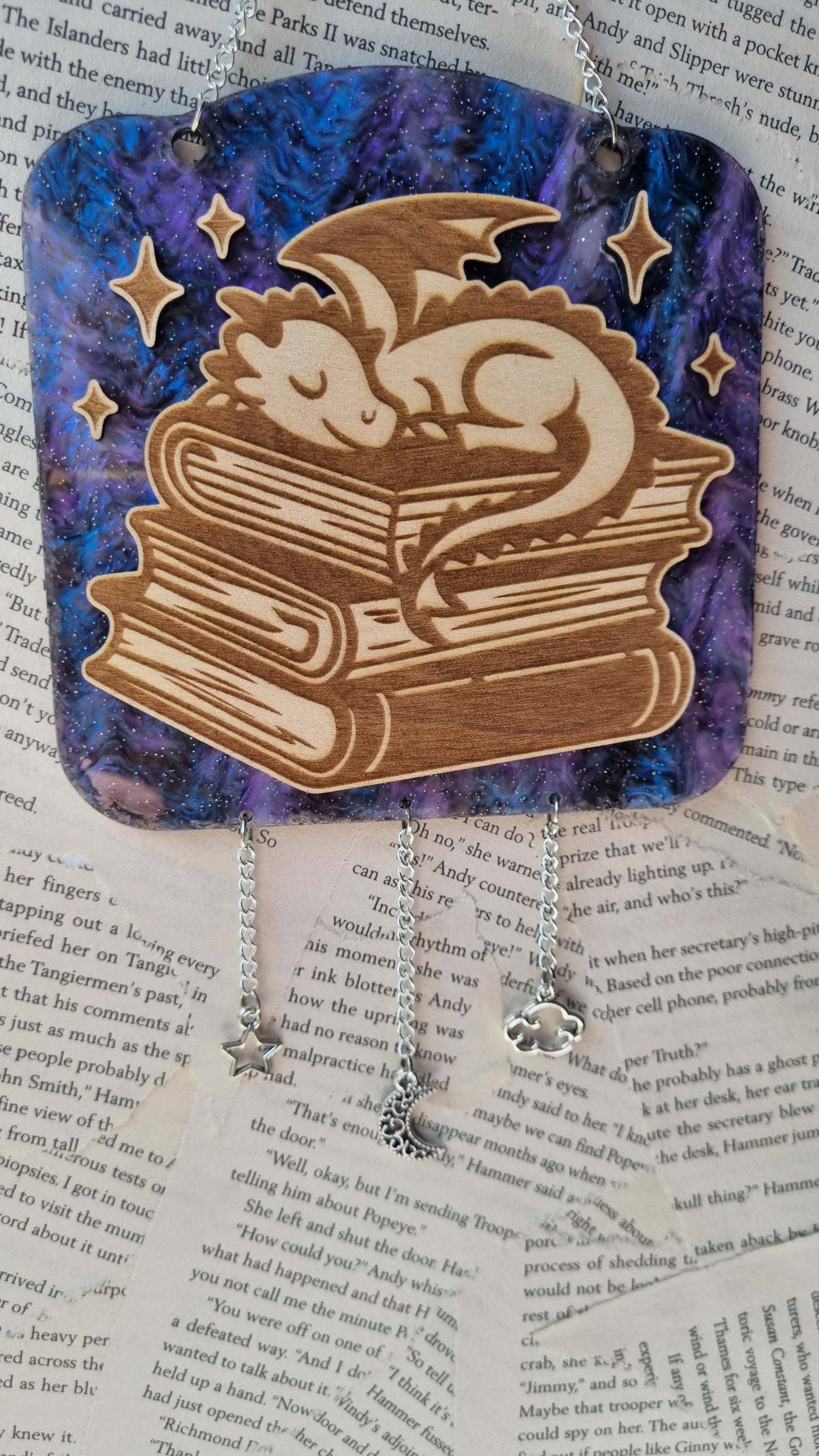 Sleepy dragon library ornament by Sublimely Special featuring a wooden dragon sleeping on books with star decorations