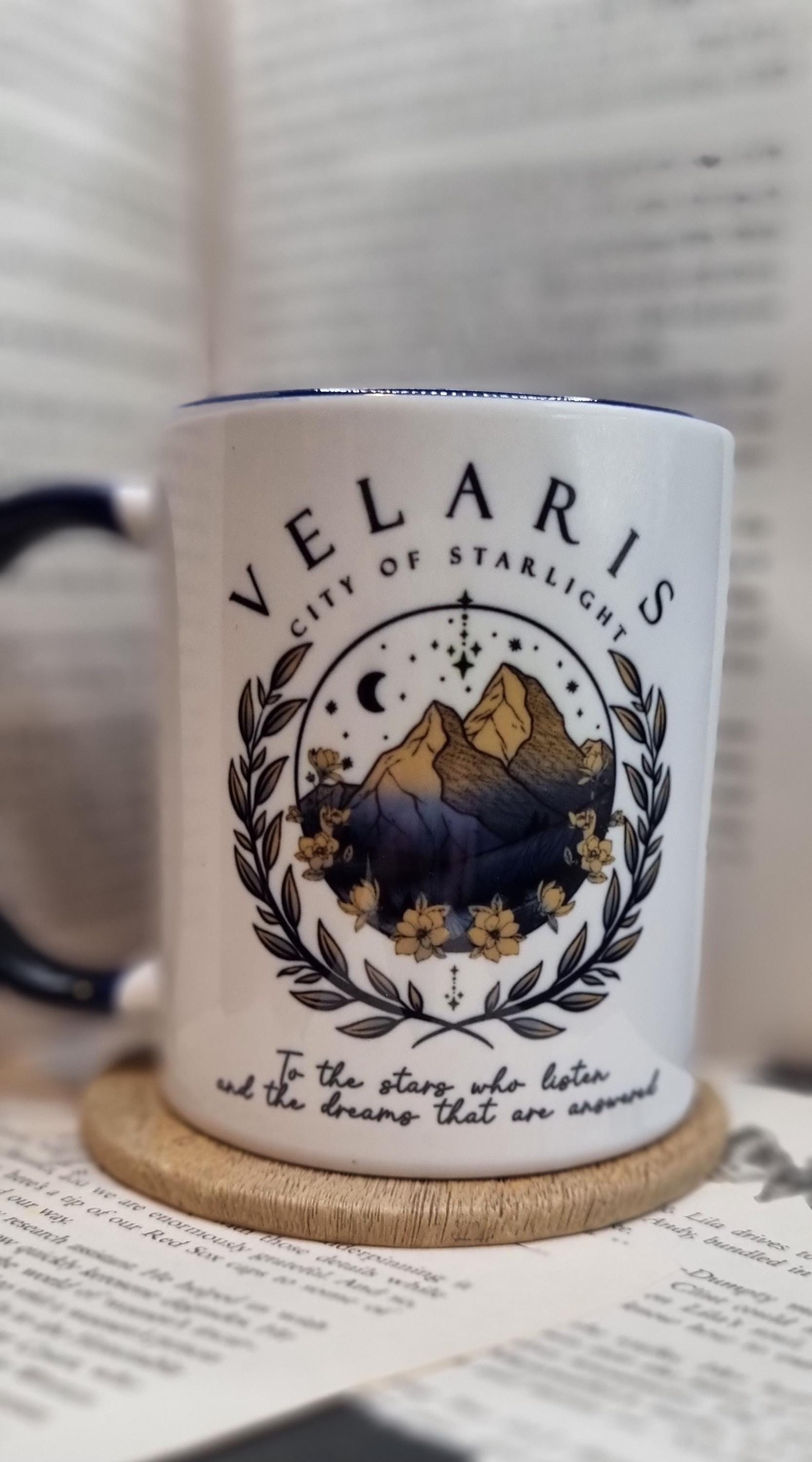 Velaris City of Starlight mug with mountain and floral design on white ceramic cup