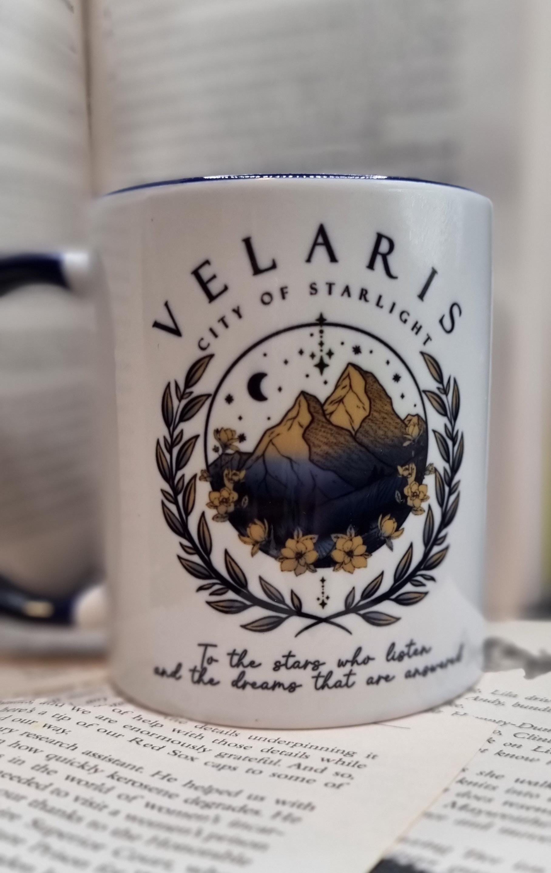White Velaris City of Starlight mug featuring mountain and floral design with inspirational text