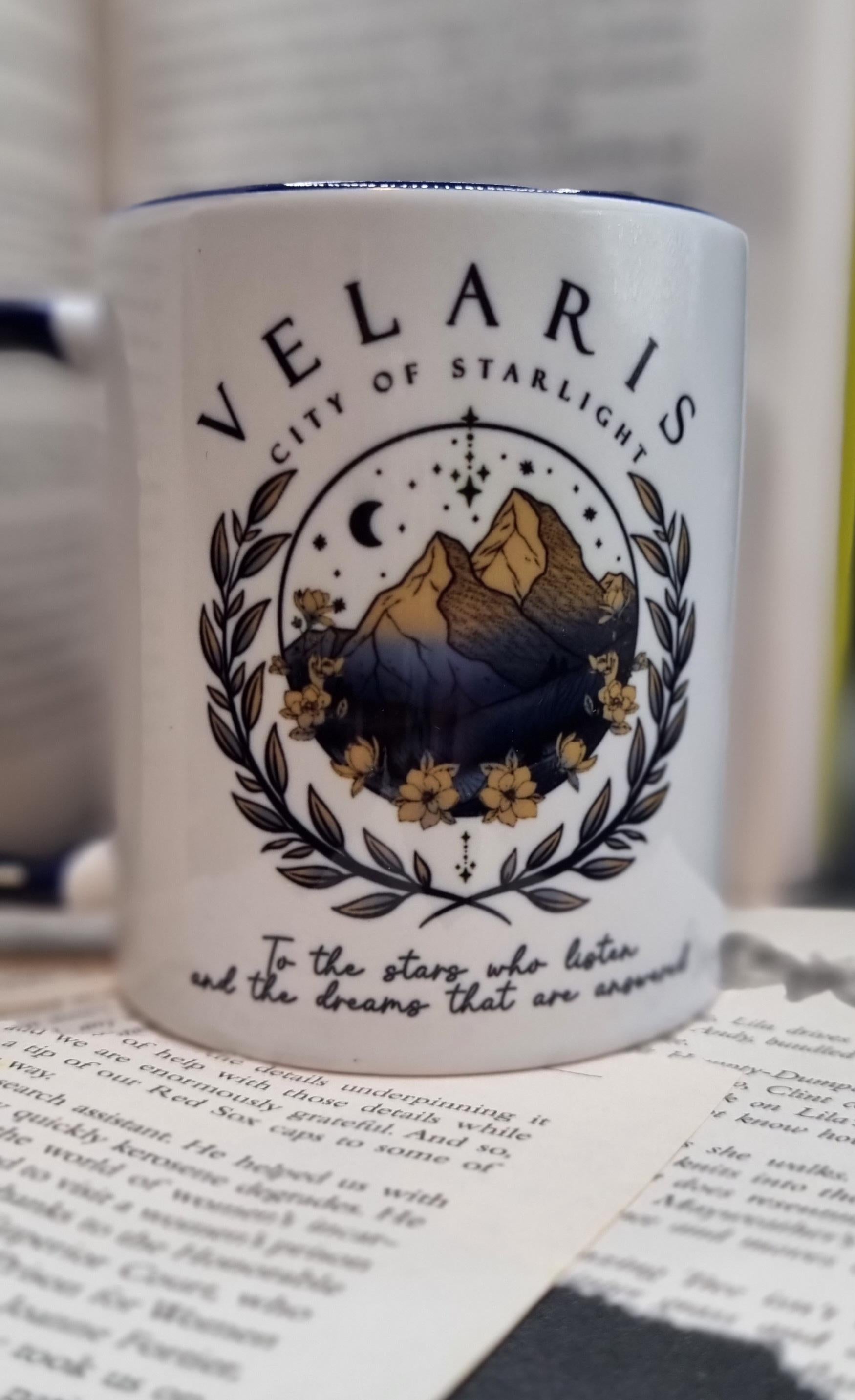 White Velaris City of Starlight mug featuring mountain and floral design with inspirational quote