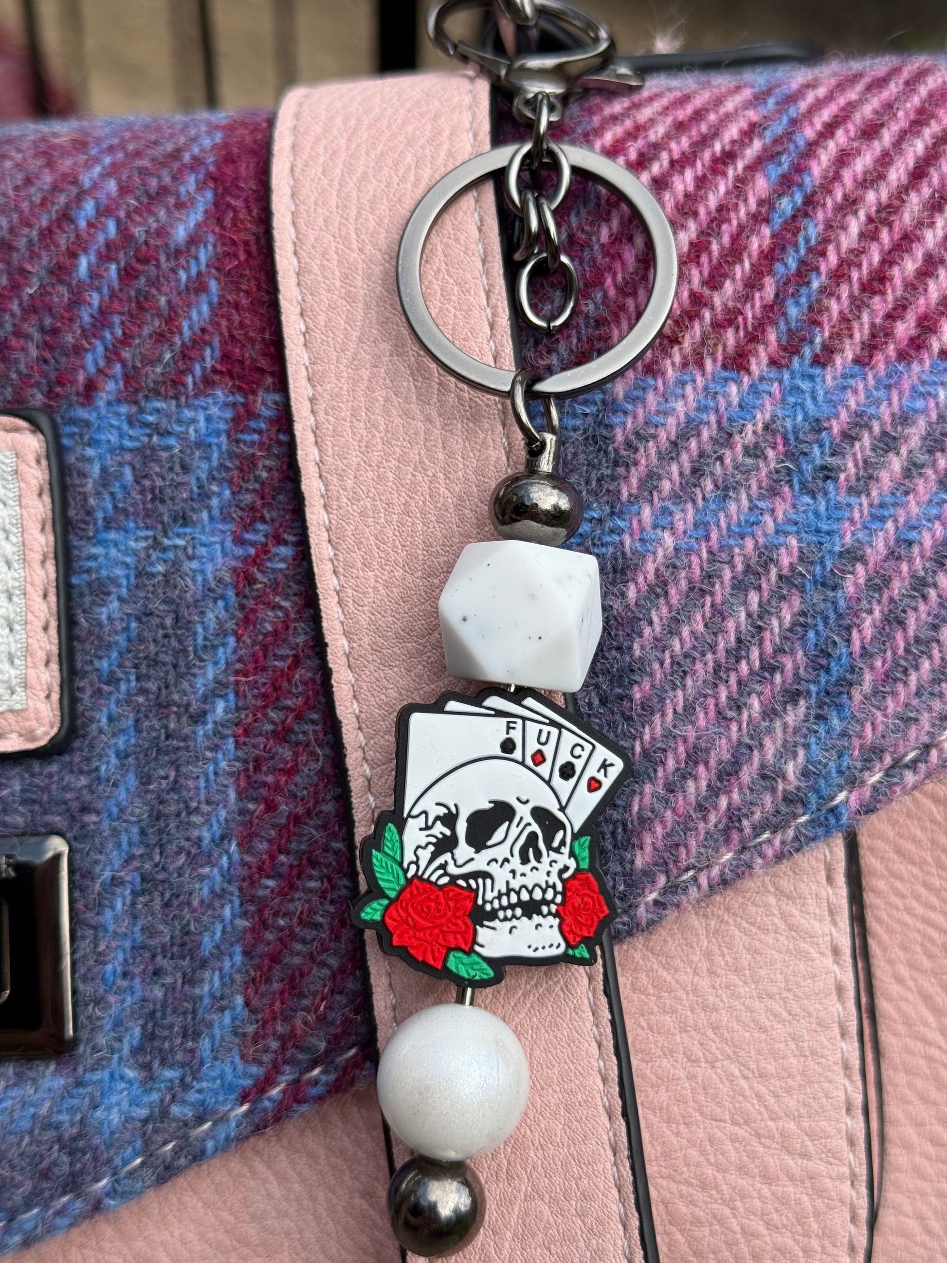 Morally grey fantasy book accessory keychain with skull, playing cards, and red roses by Sublimely Special