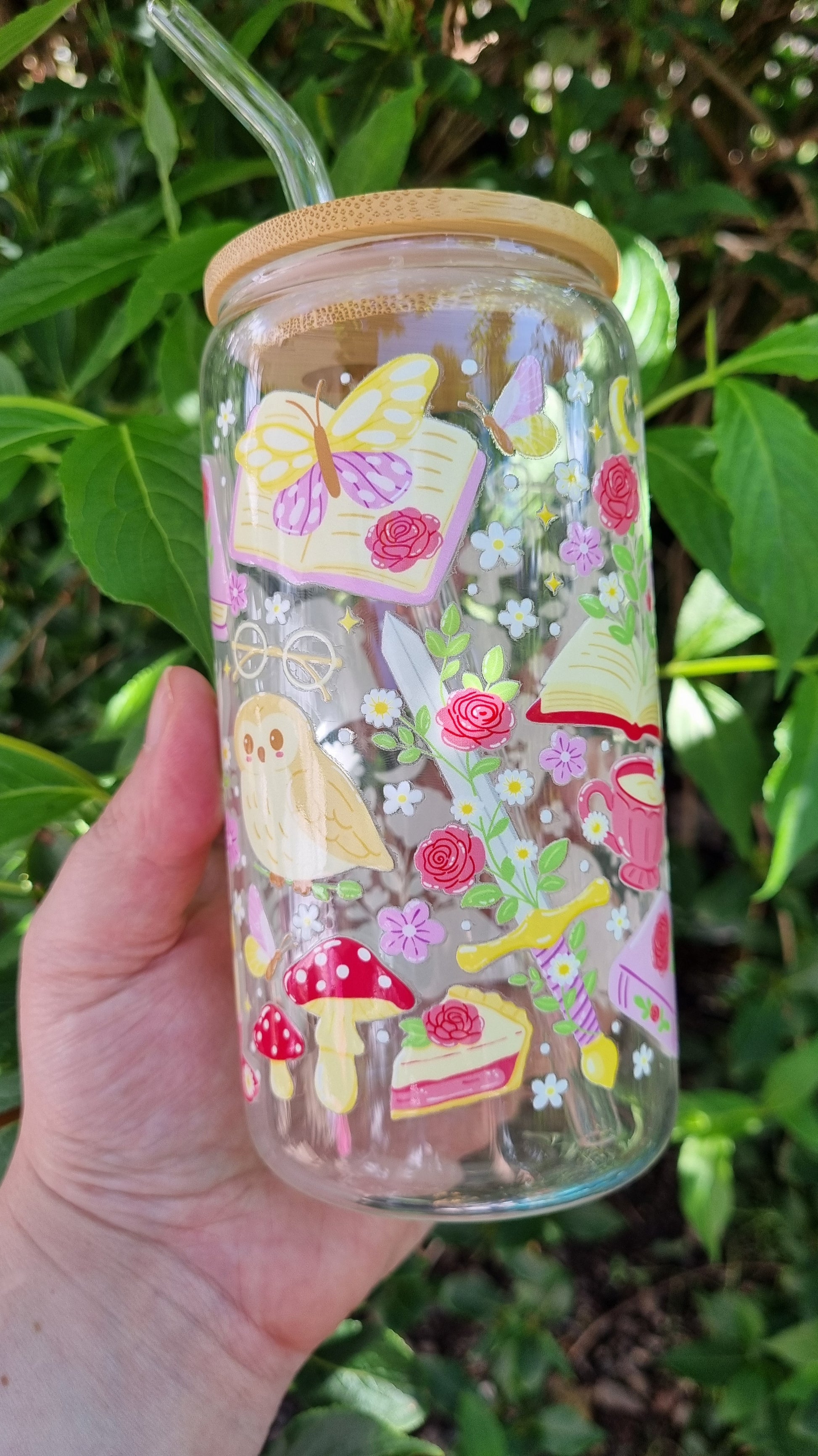 Whimsical owl glass tumbler with colourful butterfly, book, flower, and mushroom designs and bamboo lid