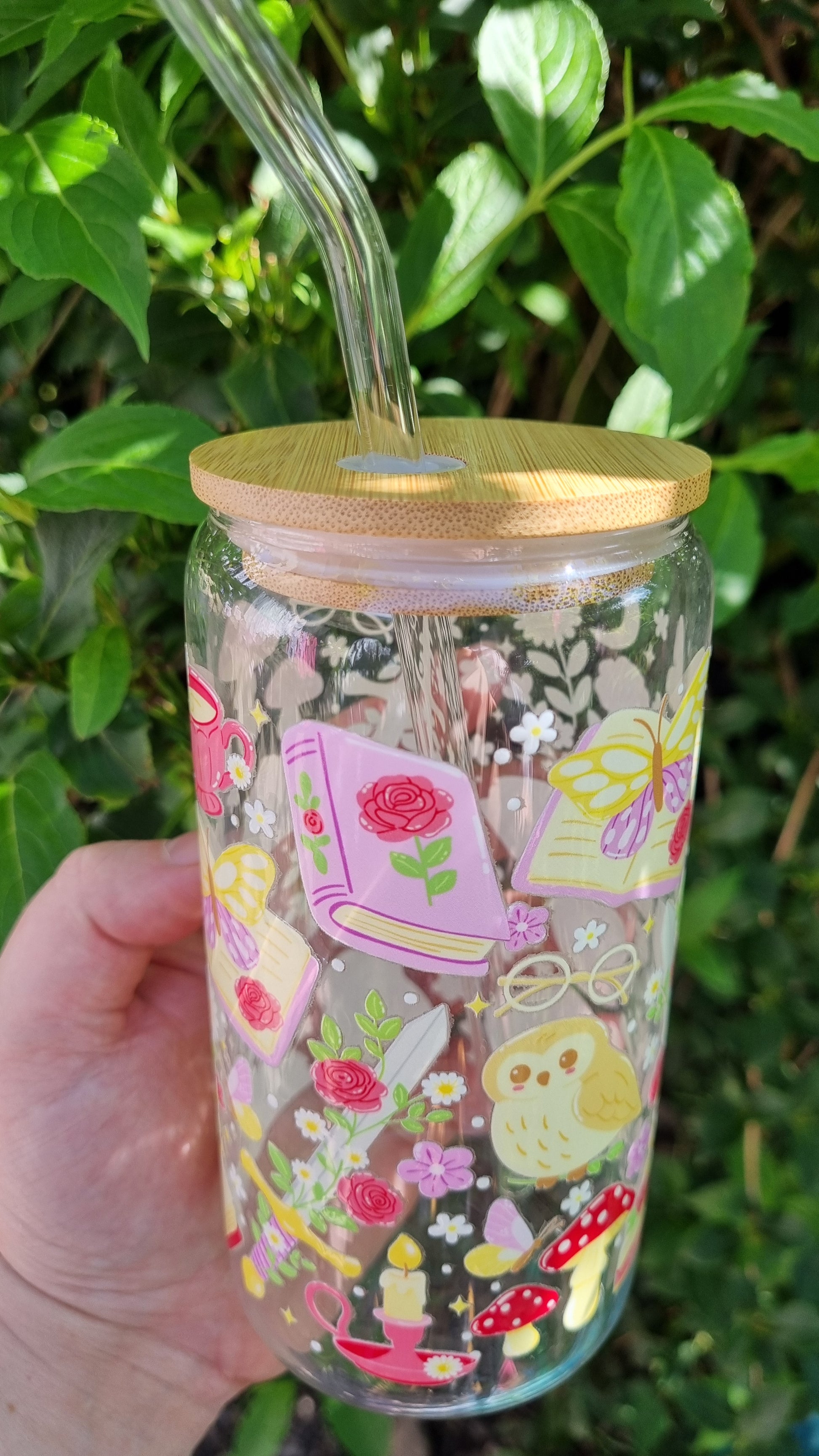 Whimsical owl glass tumbler with colourful book, flower and mushroom designs, bamboo lid, and straw