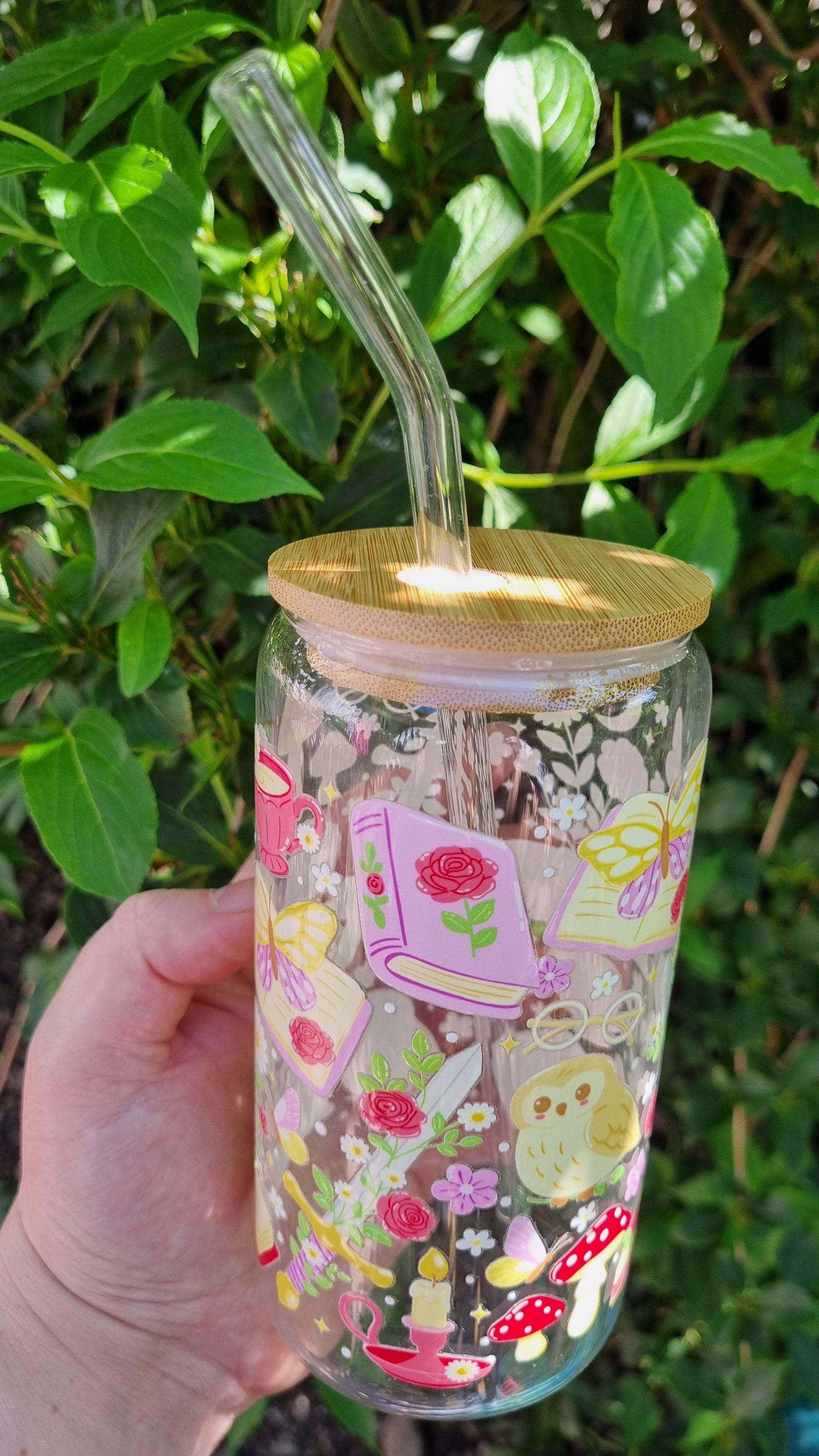 Whimsical owl glass tumbler with wooden lid and glass straw featuring colorful floral and fairy tale designs