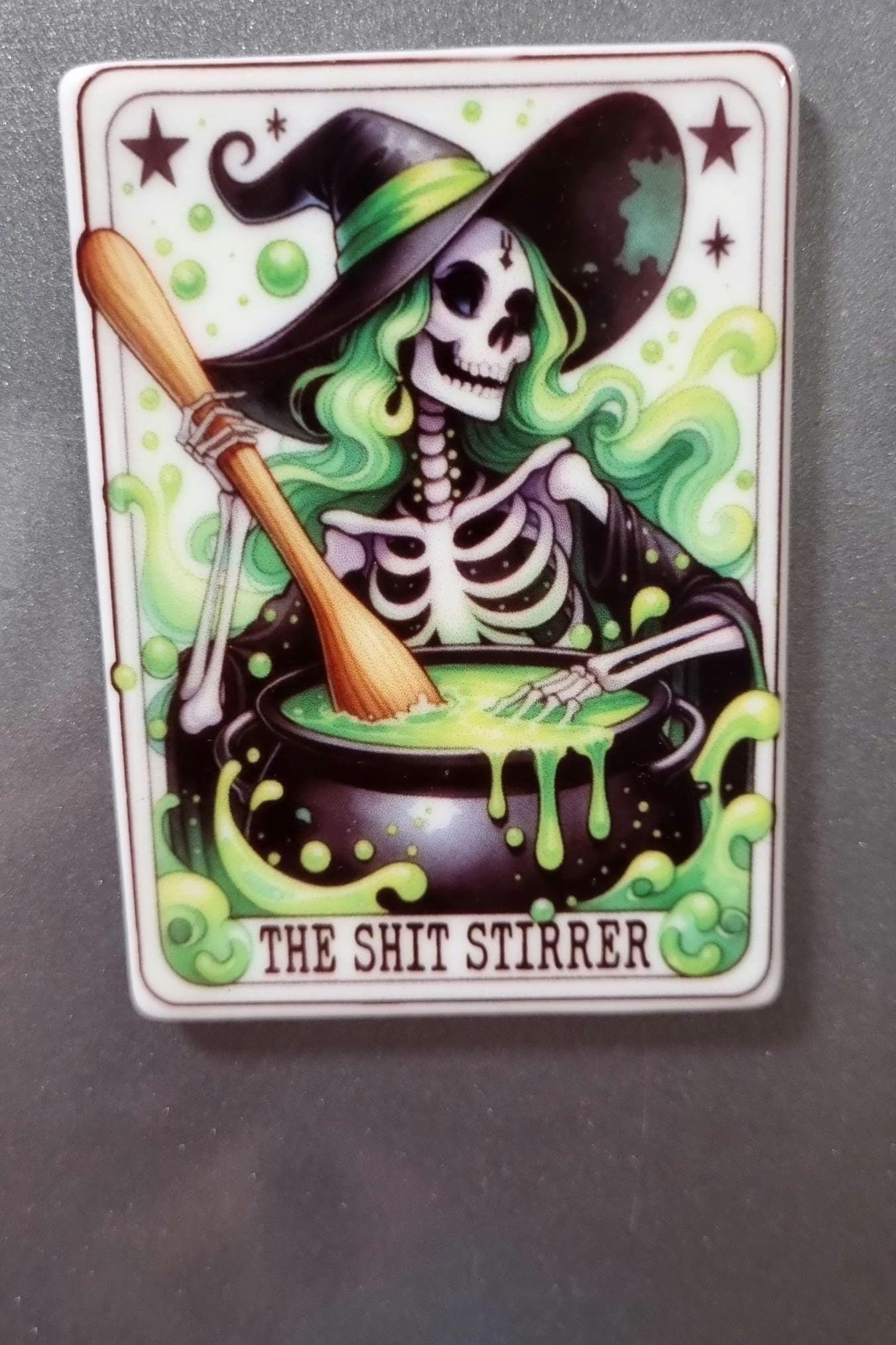 Witchy tarot fridge magnet featuring a skeleton witch stirring a bubbling green potion cauldron