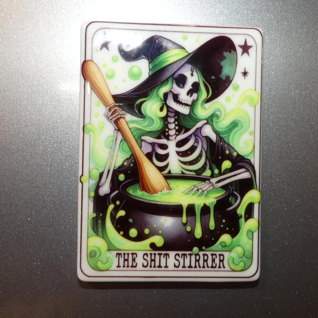 Witchy tarot fridge magnet featuring skeleton witch stirring a cauldron with green smoke
