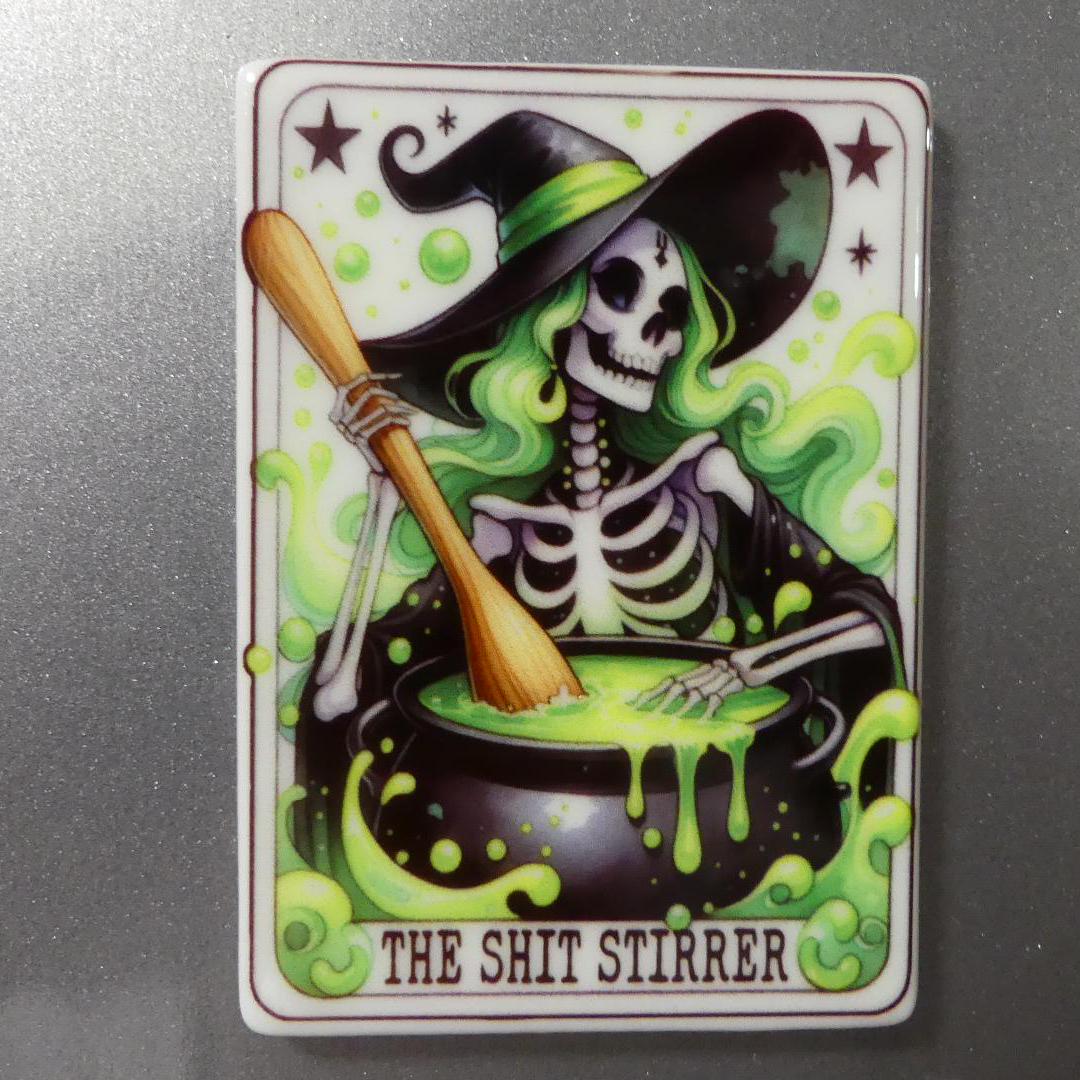Witchy tarot fridge magnet featuring a skeleton witch stirring a cauldron with green smoke